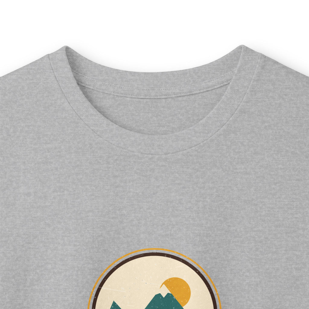 Stay Wild Mountain Long Sleeve Tee — Retro Outdoor Graphic”.